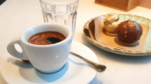 Espresso-served-with-a-glass-of-water-and-two-chocolate-sweets-Vicenza-Italy-rossiwrites.com-2.jpg