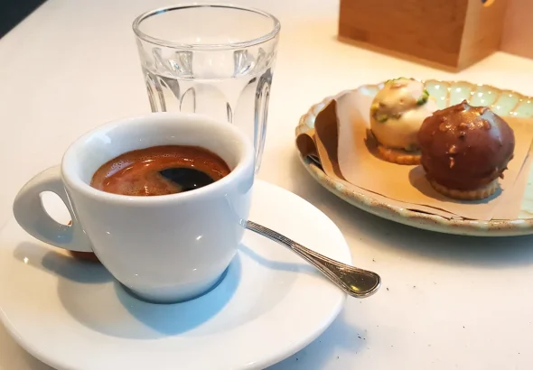 Espresso-served-with-a-glass-of-water-and-two-chocolate-sweets-Vicenza-Italy-rossiwrites.com-2.jpg